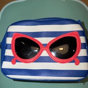 Kate Spade Make a Splash Mindy striped crossbody bag cat-eye sunglasses appliqué